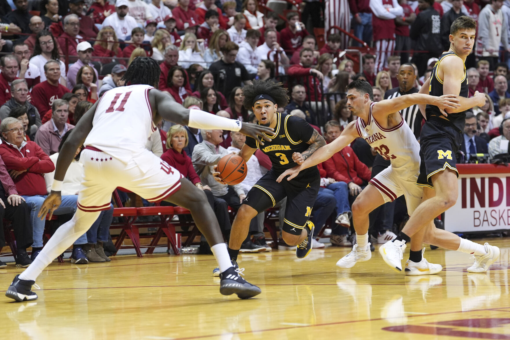 BOZICH | Win one for Woodson? Dusty May, Michigan deny Indiana, 70-67
